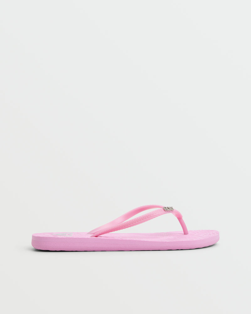 The Roxy Antilles II Sandal in pink features thin straps and a textured sole, displayed on a white background—ideal for comfortable beachwear.