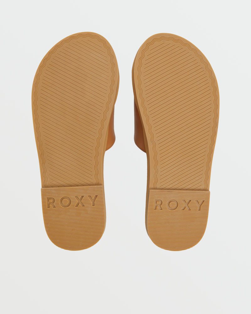 Two brown Roxy Amalfi Coast Slide Sandal soles feature diagonal textured patterns and "ROXY" embossed on each heel, shown on a white background—ideal for a classic beach style.