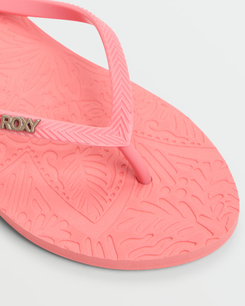 Close-up of the Roxy Antilles II Sandal—a comfortable pink beach sandal with a textured leaf-pattern footbed, matching strap, and a small metallic ROXY logo.