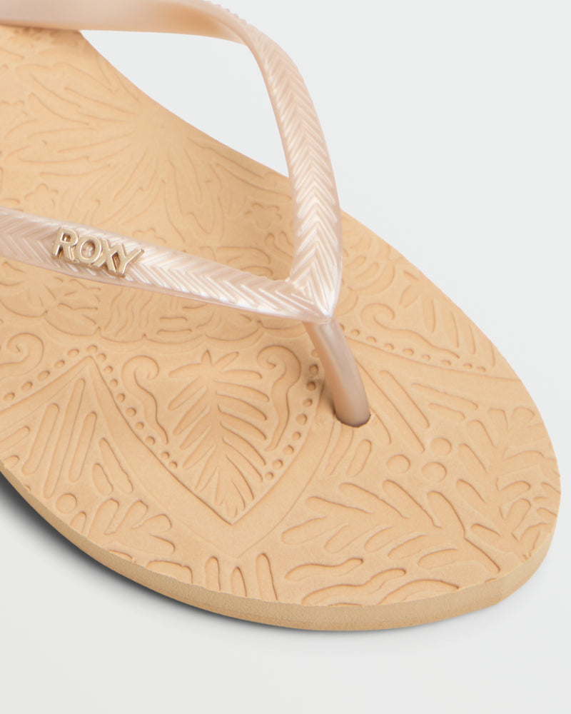 Close-up of the beige Roxy Antilles II Sandal, featuring a textured leaf-patterned footbed and translucent strap with metallic Roxy logo—stylish and comfortable beach sandals for flip flop lovers.