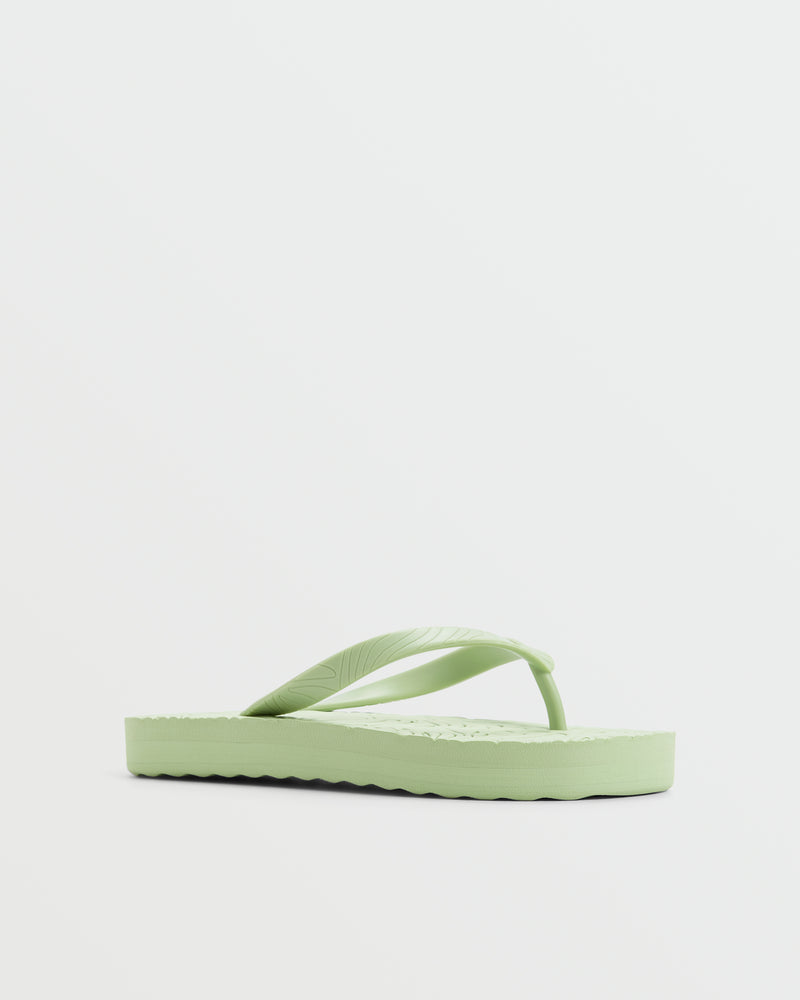 A single light green Beach Up Sandal by Roxy with textured straps and a ridged sole, ideal for casual beachwear, displayed on a plain white background.