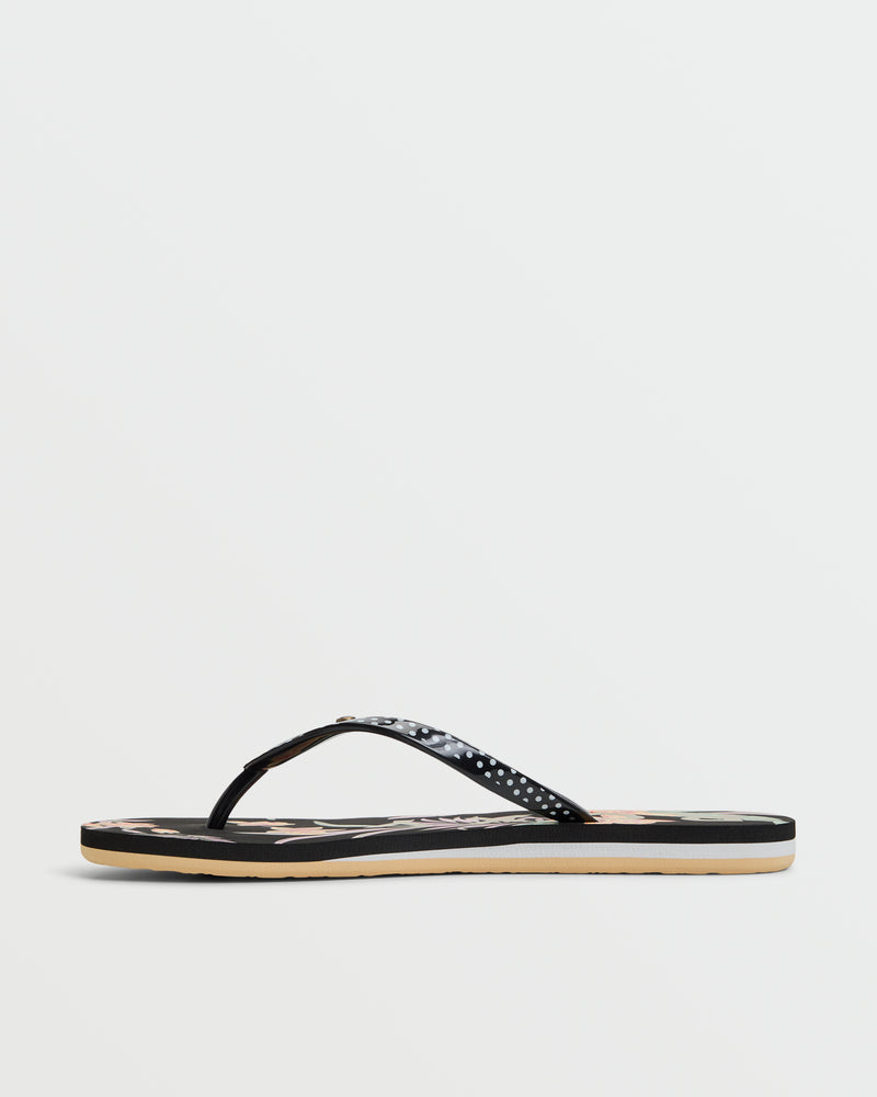A single black Roxy Portofino III Sandal with a thin, glossy strap and flat sole is displayed on a plain white background—ideal as comfortable summer sandals.