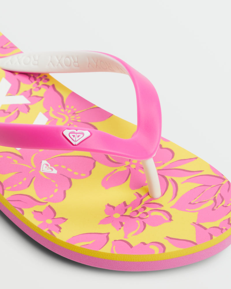 A close-up of Roxy's Tahiti VII Sandal, showcasing a yellow base with pink floral patterns, pink and white straps, and a small heart-shaped logo—ideal for summer sandal lovers.