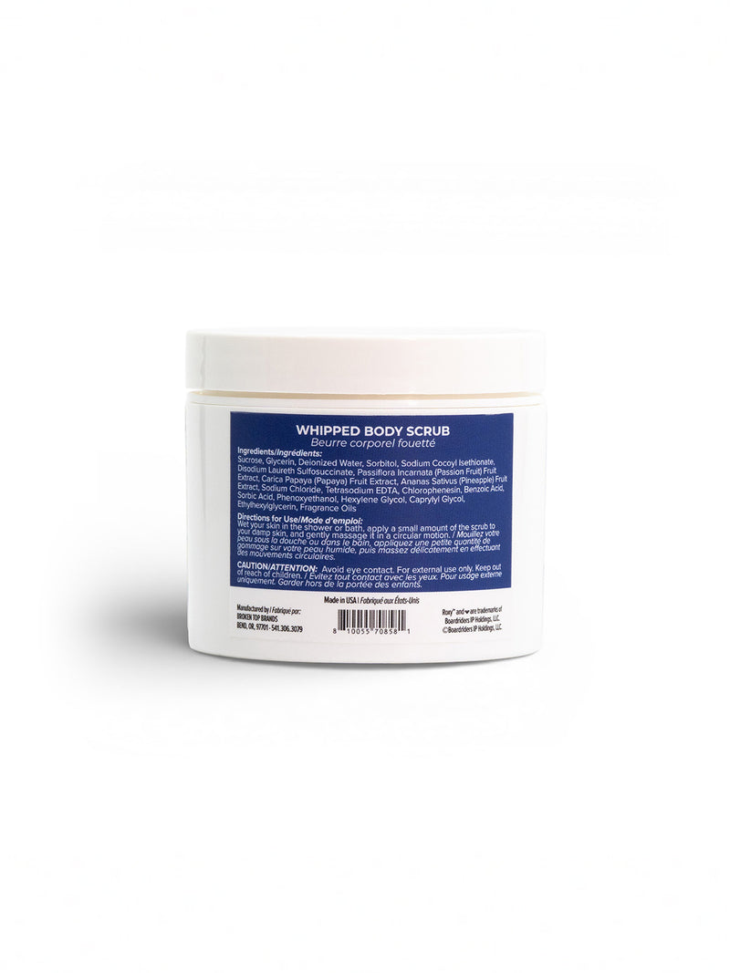 The Deep Dive Body Scrub by Roxy comes in a white plastic jar with a white screw-on lid and a blue label on the back showing ingredients and directions. The exfoliating scrub is presented against a plain white background.