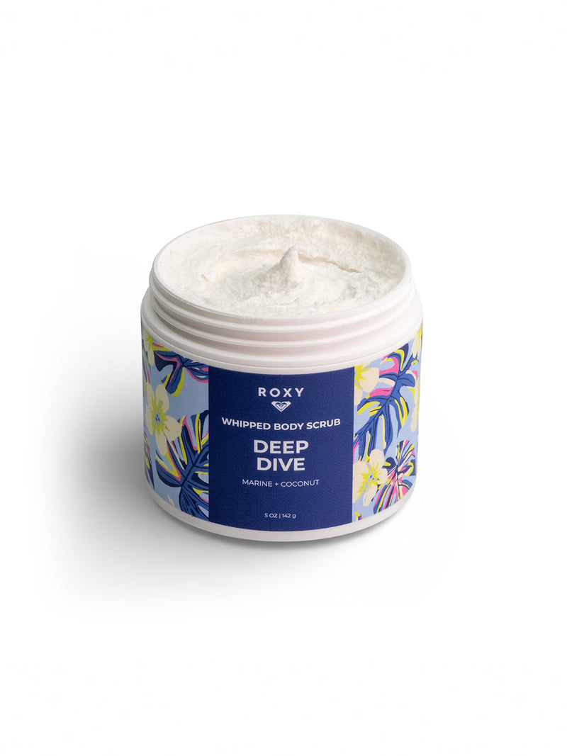 A tub of Roxy Deep Dive Body Scrub with a marine and coconut scent features floral and leaf designs. The lid is off, showing the creamy exfoliating scrub inside.