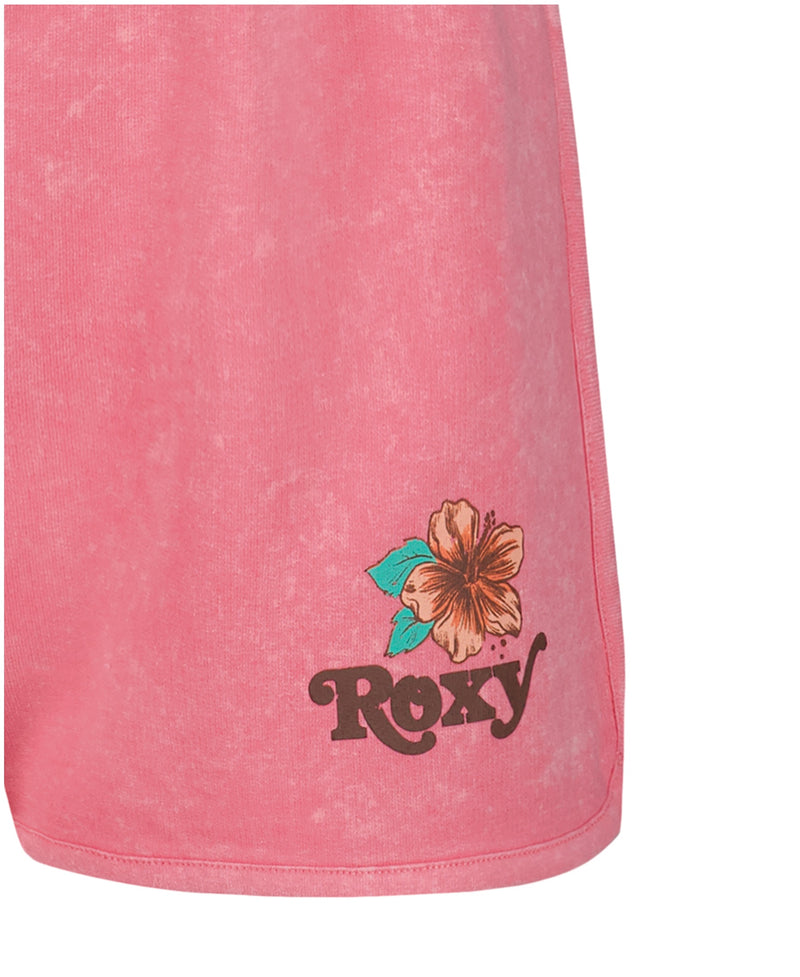 Close-up of Roxy Girls' Sunset Short in pink French terry, featuring a hibiscus flower graphic and "Roxy" printed in brown near the hem.