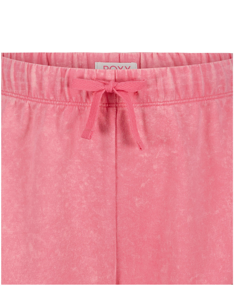 Close-up of Girls' Sunset Short by Roxy in pink French terry, featuring an elastic waistband with matching pink drawstring and a visible back label.