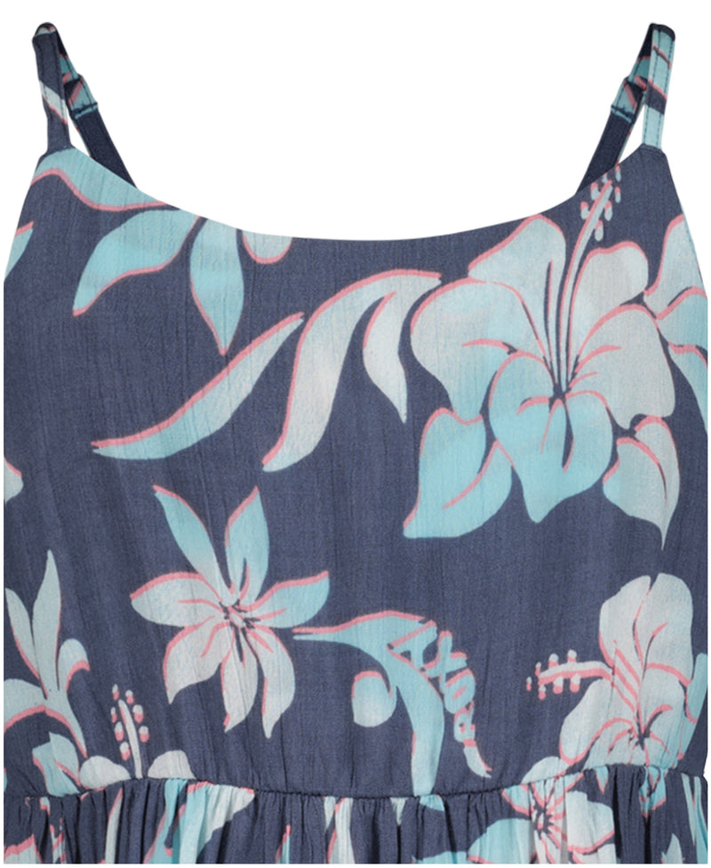Close-up of the Roxy Girls' Hibiscus Hype Dress featuring thin straps and a blue background with light blue, pink, and white tropical flowers. Large stylized blooms give this fit-and-flare dress a fresh, summery vibe.