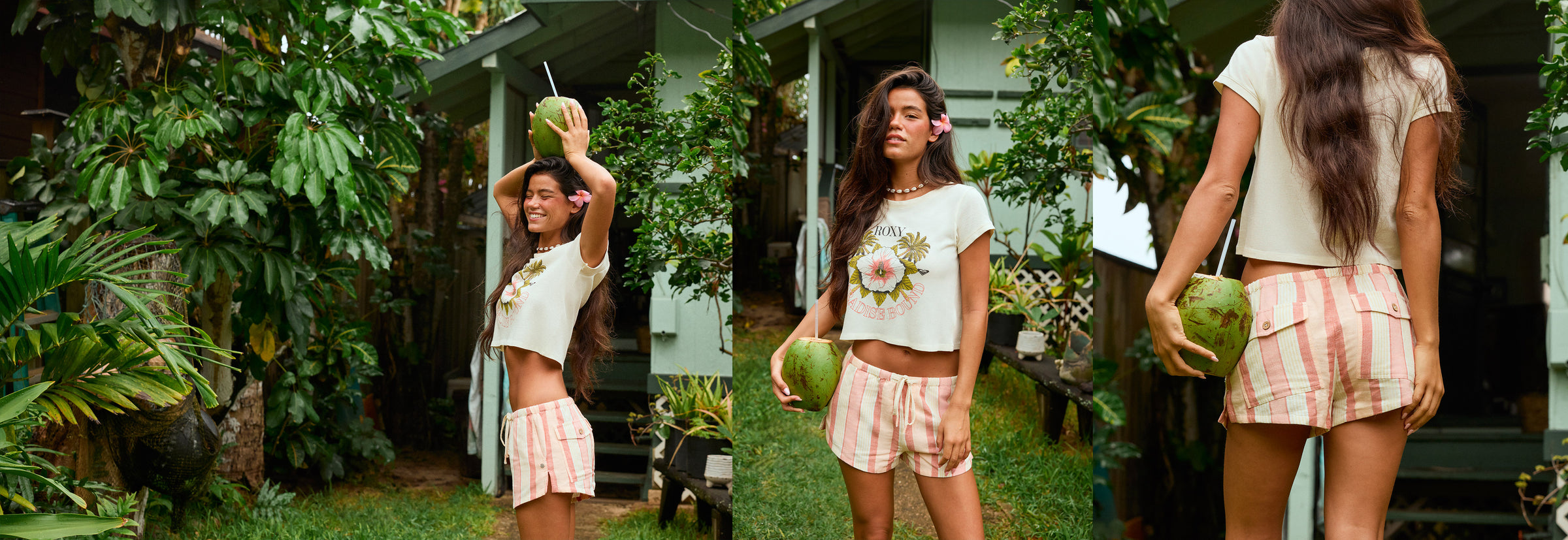Woman holding a watermelon in a tropical setting with greenery and a house in the background