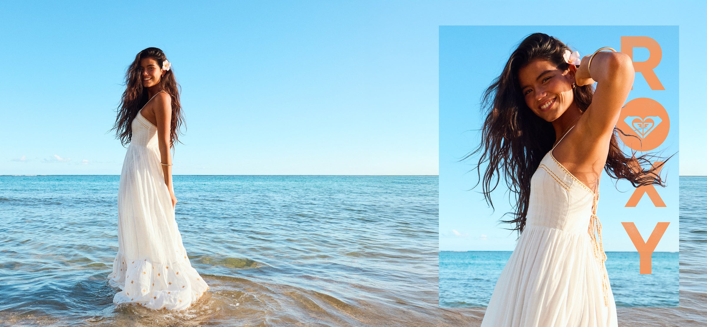 Woman in a white dress standing on a beach with a clear blue sky.