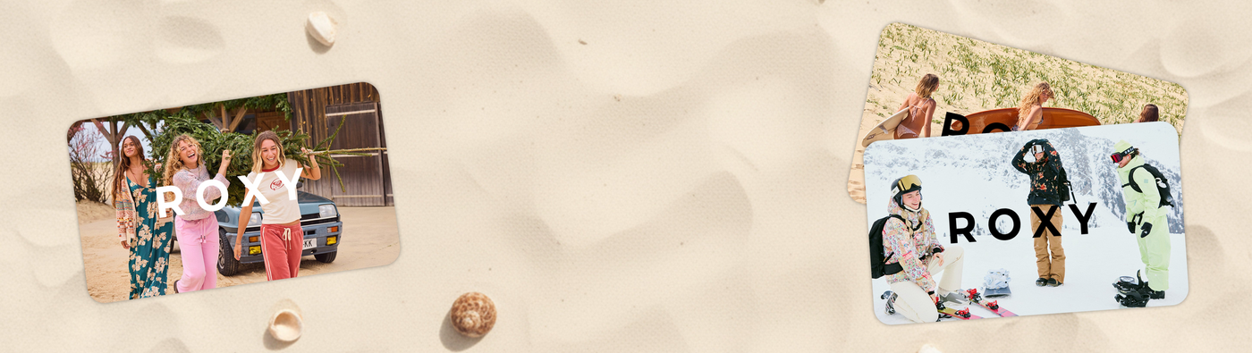 Roxy gift cards on sand with beach-themed images