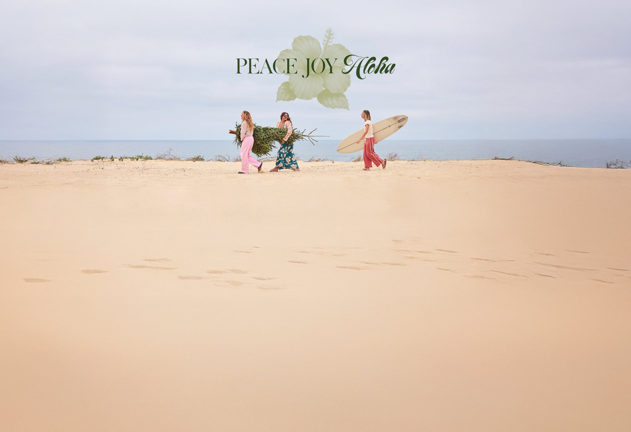 Three people on a sandy beach with surfboards and flowers, featuring 'Peace Joy Aloha' text.