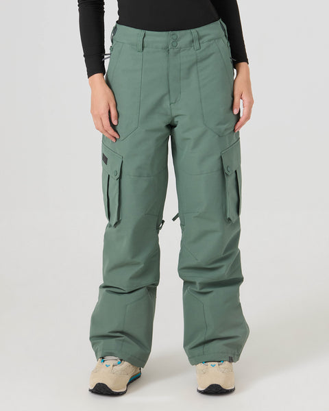 A person wearing Roxy Trooper Cargo Pants in Duck Green, along with a black long sleeve top and beige sneakers, stands against a light gray background. Only the lower half of their body is visible.