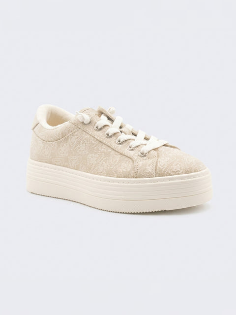The Roxy Sheilahh 2.0 Sneaker features a beige upper with white laces, a subtle textured pattern, and a chunky off-white rubber sole, shown against a light gray background.