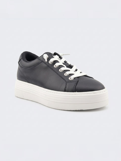 The Roxy Sheilahh 2.0 Sneaker is a black leather shoe with white laces and a chunky, textured white platform sole, shown against a plain light grey background.