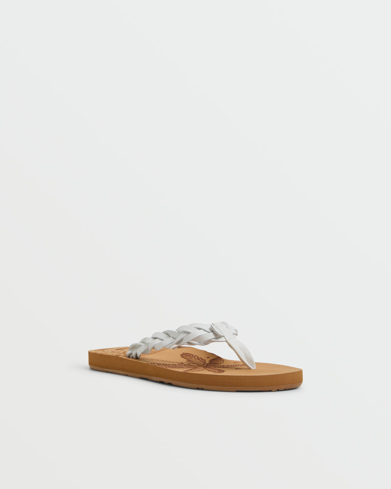 The Roxy Feel Breezie Sandal features a light brown flat sole and a white braided thong strap, shown on a plain white background—ideal for stylish, comfortable wear at the beach.