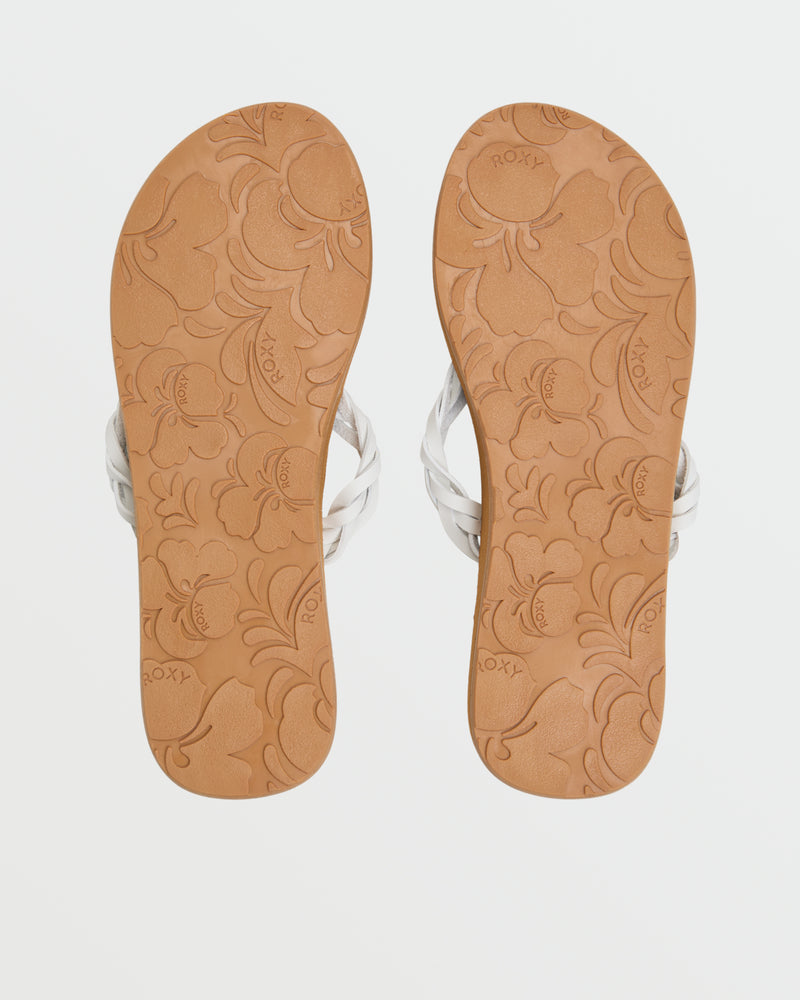 A pair of tan Roxy Feel Breezie Sandals with white straps, shown from above with embossed floral patterns and the Roxy name on the soles.
