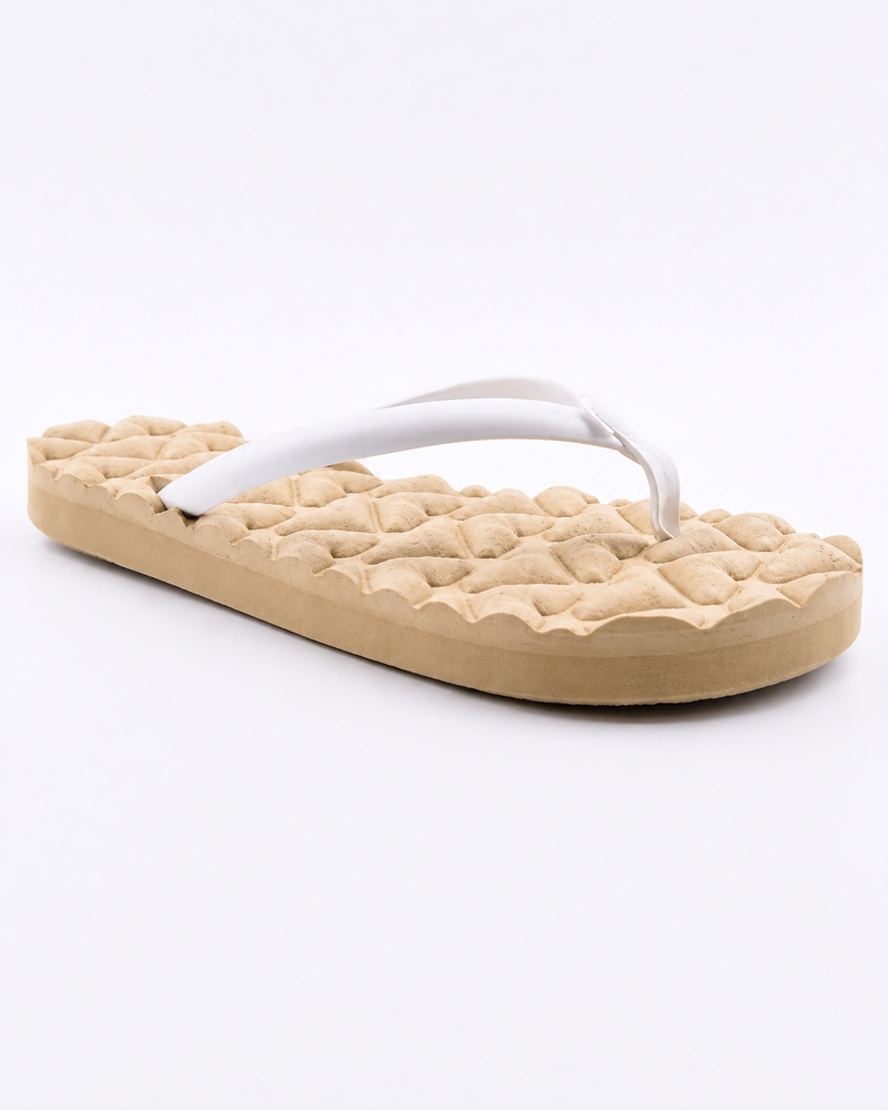 The Roxy Shoresoft Sandal offers a beige, quilted-look cushioned footbed with white straps for all-day comfort. Perfect for daily wear and shown against a white background.
