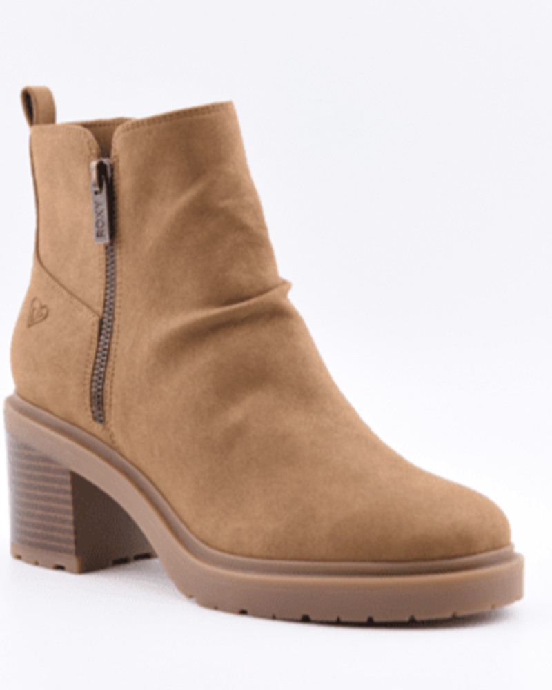 The Roxy Clementine Boot is a tan faux suede ankle boot with a chunky block heel, side zipper, small back pull tab, slightly rounded toe, and subtle stitched Roxy logo on the side.
