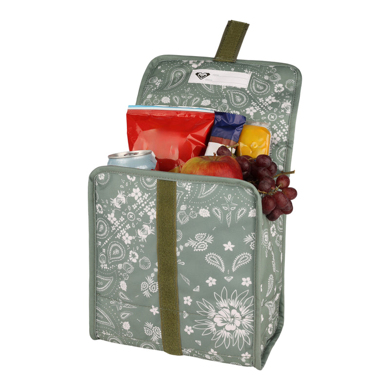 The Roxy Smiling Seagulls Lunch Bag, featuring a cheerful green design with playful prints and a white floral pattern, is open to reveal snacks inside—including a red apple, grapes, a can, and assorted packaged treats.