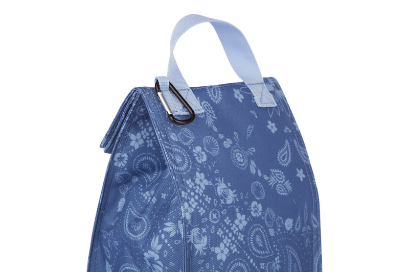 The Roxy Lunch Hour Lunch Bag features a blue design with a white paisley pattern, a white handle, and a metal clasp at the top.