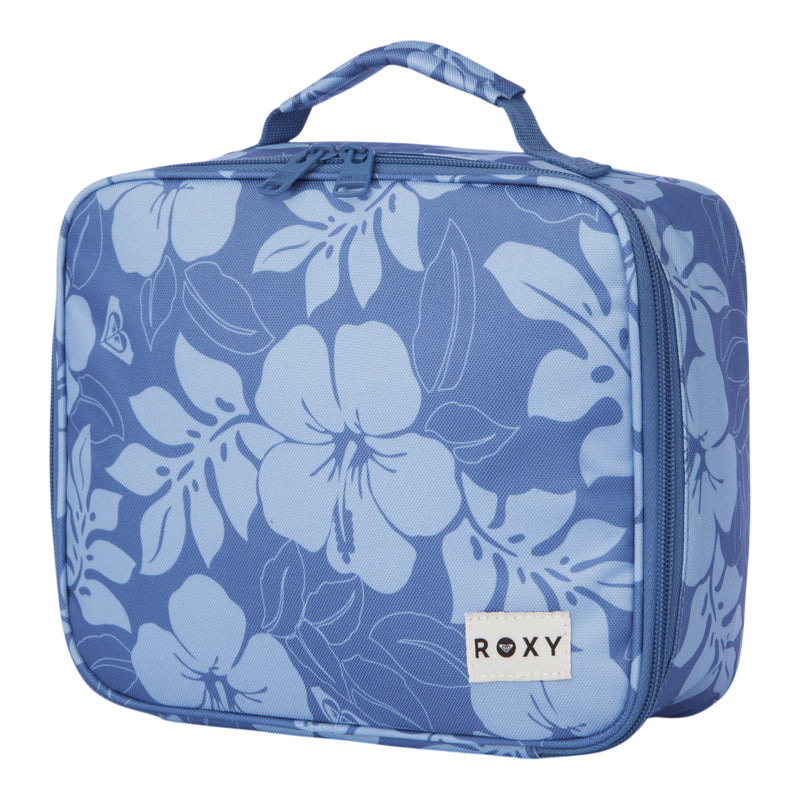 The Groove In Life Lunch Box by Roxy features a blue design with a light blue hibiscus flower pattern, a convenient top handle, and a secure zipper closure. A white patch with the ROXY logo is sewn onto the lower right corner.