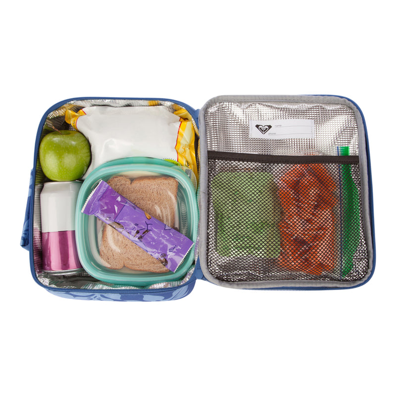The Roxy Groove In Life Lunch Box is open to reveal its compartments neatly organizing a green apple, a sandwich, snack bars, a drink, and bags filled with snacks. The lunch box also features a mesh pocket that holds napkins and small food items.