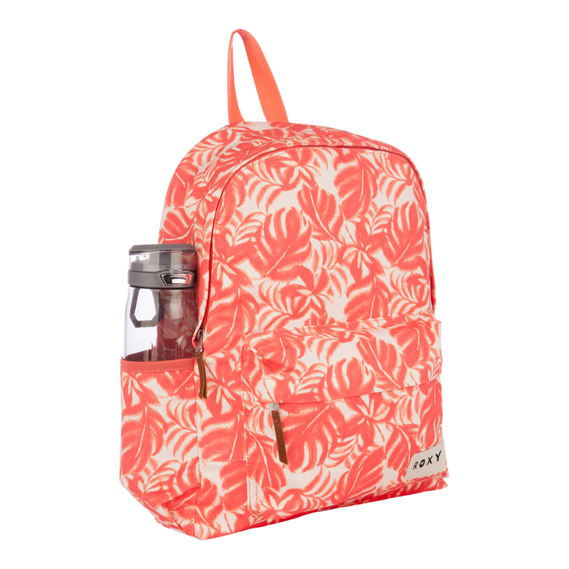 The Roxy Sugar Baby Canvas Backpack features a vibrant coral and white color scheme with a tropical leaf pattern. Crafted from recycled cotton, it includes an orange handle, a front pocket adorned with the signature Roxy brand label, and convenient side mesh pouches—one holding a visible gray water bottle. Perfect for everyday use.