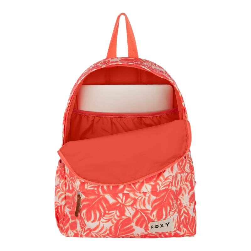 A coral and white floral Sugar Baby Canvas Backpack by Roxy sits with its top flap open, revealing a laptop in the main compartment—perfect for everyday use.
