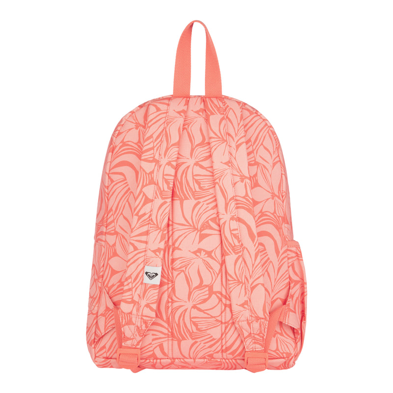 Coral pink ROXY Sugar Baby Canvas Backpack featuring a white tropical leaf pattern, made from recycled cotton for eco-friendly style. Details include two padded shoulder straps, a top handle, and a small white ROXY logo patch on the back.