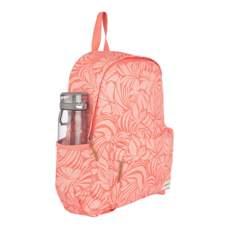 A coral pink ROXY Sugar Baby Canvas Backpack featuring a tropical leaf pattern, front pocket, and a clear water bottle in the side pocket is displayed on a white background—an eco-friendly and stylish option for those who value sustainable fashion.