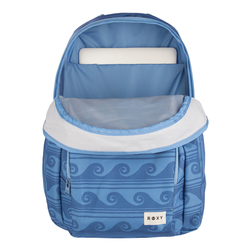 The ROXY Shadow Swell Backpack in blue features a wave pattern and an open design displaying its padded laptop sleeve with a laptop inside. The front pocket is adorned with a ROXY label, and the backpack includes a white zippered flap.