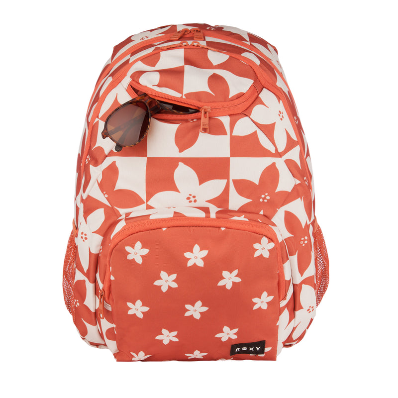 Orange and white floral-patterned Shadow Swell Backpack by ROXY, featuring two mesh side pockets, a front zipper pocket, and sunglasses partially tucked into the top zipper pocket. The ROXY brand label is displayed on the lower front pocket.