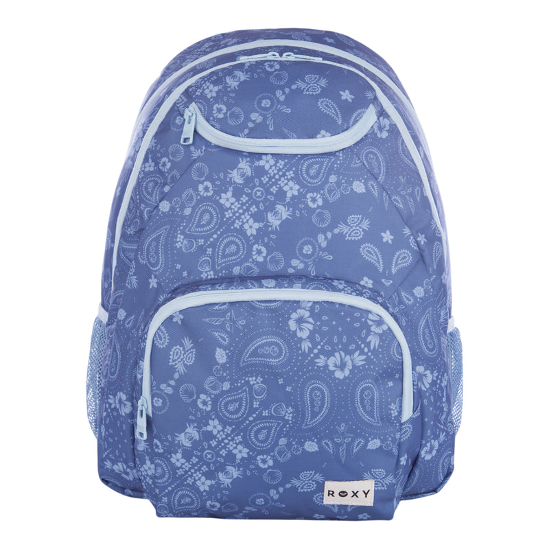 The Roxy Shadow Swell Backpack features a blue design with a light blue paisley and floral pattern, light blue zippers, mesh side pockets, and a white Roxy logo patch on the front pocket.