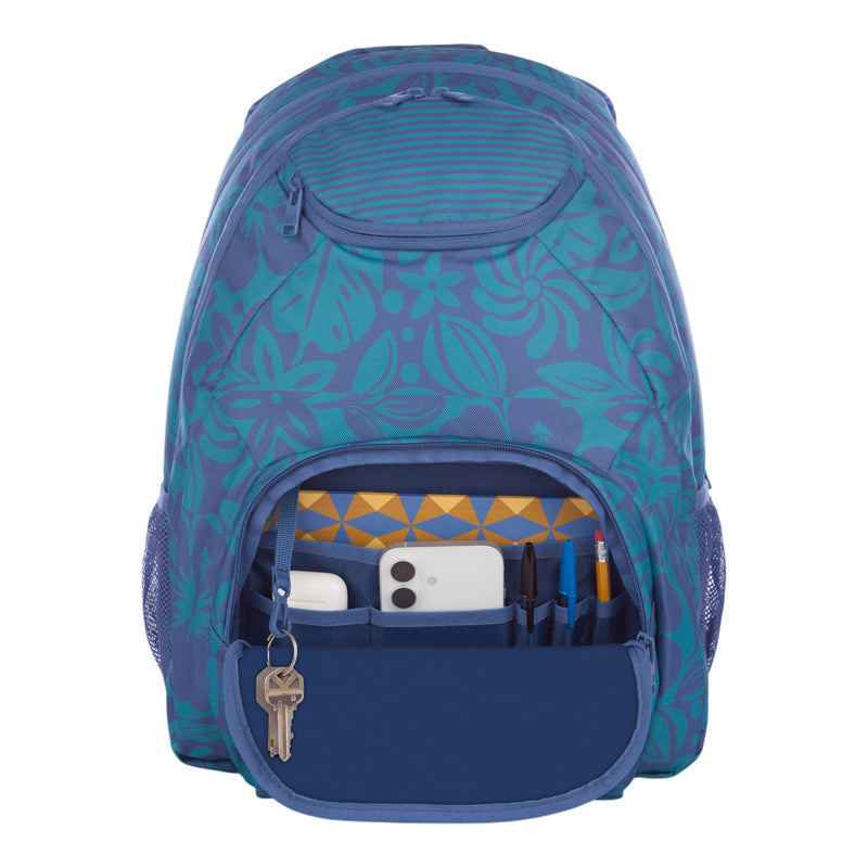 A Roxy Shadow Swell Backpack in blue floral print is shown with its front pocket open, revealing an organized interior containing a smartphone, pens, a pencil, a USB drive, and a key secured to the built-in key holder.
