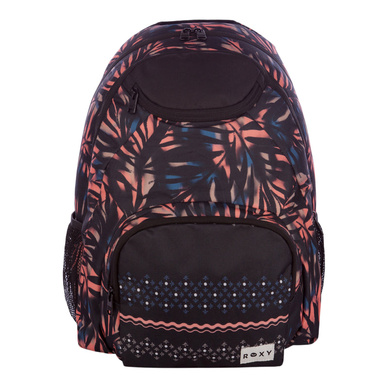 The Roxy Shadow Swell Backpack features a vibrant, tropical leaf print, a spacious main compartment, a front pocket with geometric patterns, mesh side pockets, and a small white Roxy logo label.