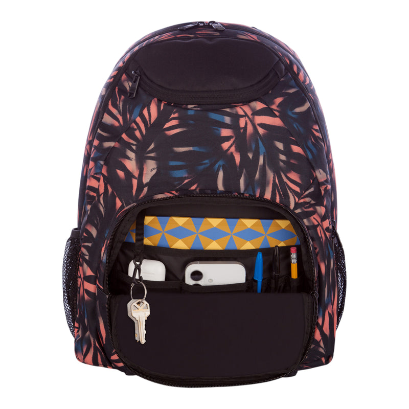 A Roxy Shadow Swell Backpack featuring a geometric pattern and an open front pocket displaying keys, a phone, pens, a pencil, and a geometric-patterned notebook inside.