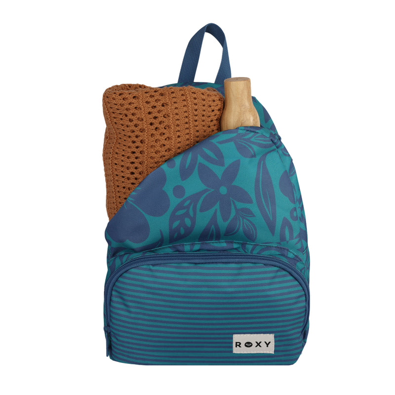 A teal and blue floral Always Core Printed Backpack by Roxy with a brown knit sweater and a wooden-handled item sticking out of the top.