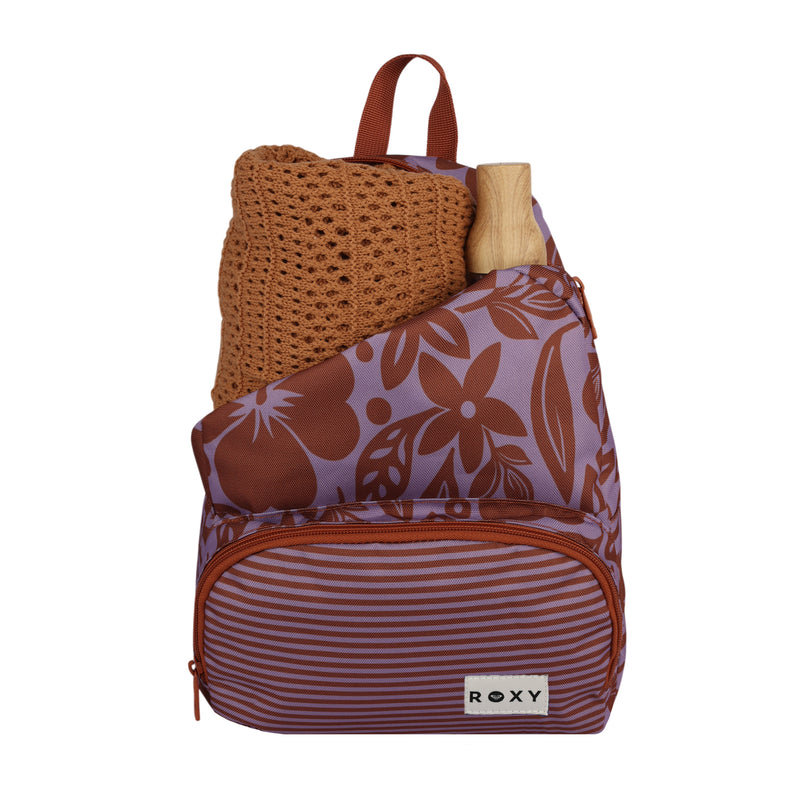 An Always Core Printed Backpack by Roxy in a purple and brown floral design, featuring a striped front pocket, containing a brown knitted sweater and an item with a wooden handle inside.