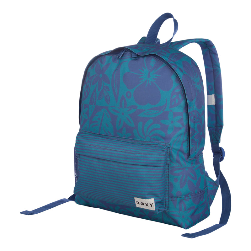The Roxy Sugar Baby Bottle Backpack features a blue design with floral and striped patterns, a spacious main compartment, a front zip pocket, adjustable straps, and a small ROXY label on the lower right front pocket.