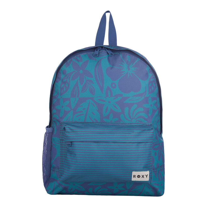 The Roxy Sugar Baby Bottle Backpack features a blue floral pattern, a front zippered pocket with stripes, a mesh side pocket, and a small white ROXY logo tag in the bottom right corner. It also has a loop handle at the top for convenient hanging.