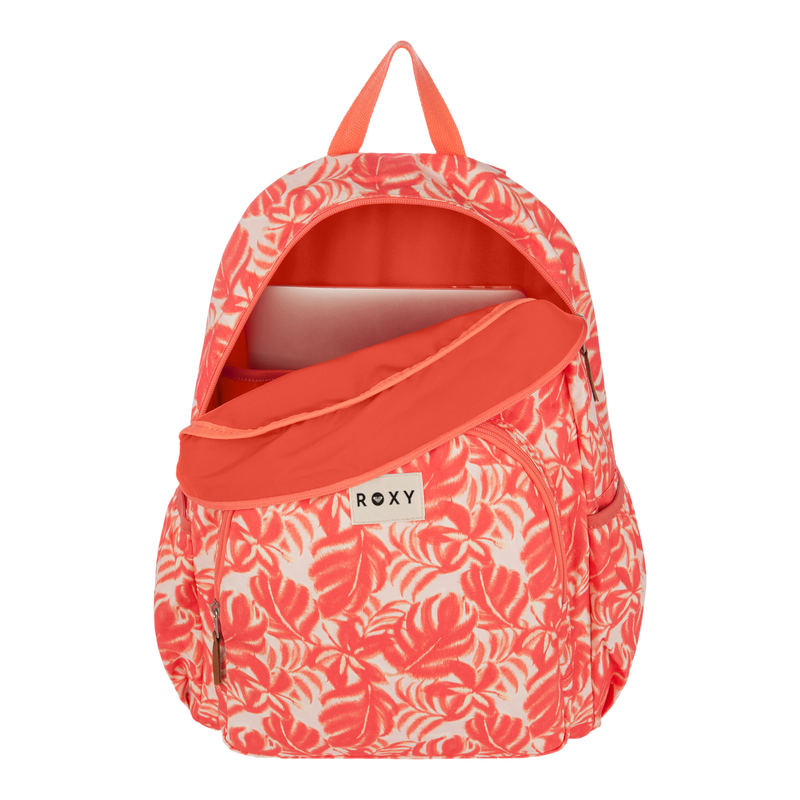 The Moon Magic Backpack by Roxy in coral and white floral is shown with its main zipper compartment open, revealing a laptop inside. This stylish women’s backpack features a front zip pocket, two side pockets, and a fabric handle on top.
