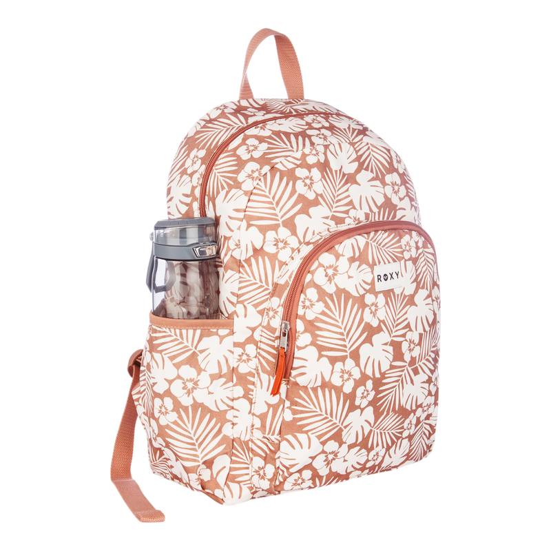 A Roxy Moon Magic Backpack featuring pink and white floral patterns, tan straps, a front pocket, and a clear water bottle tucked into its side pocket.