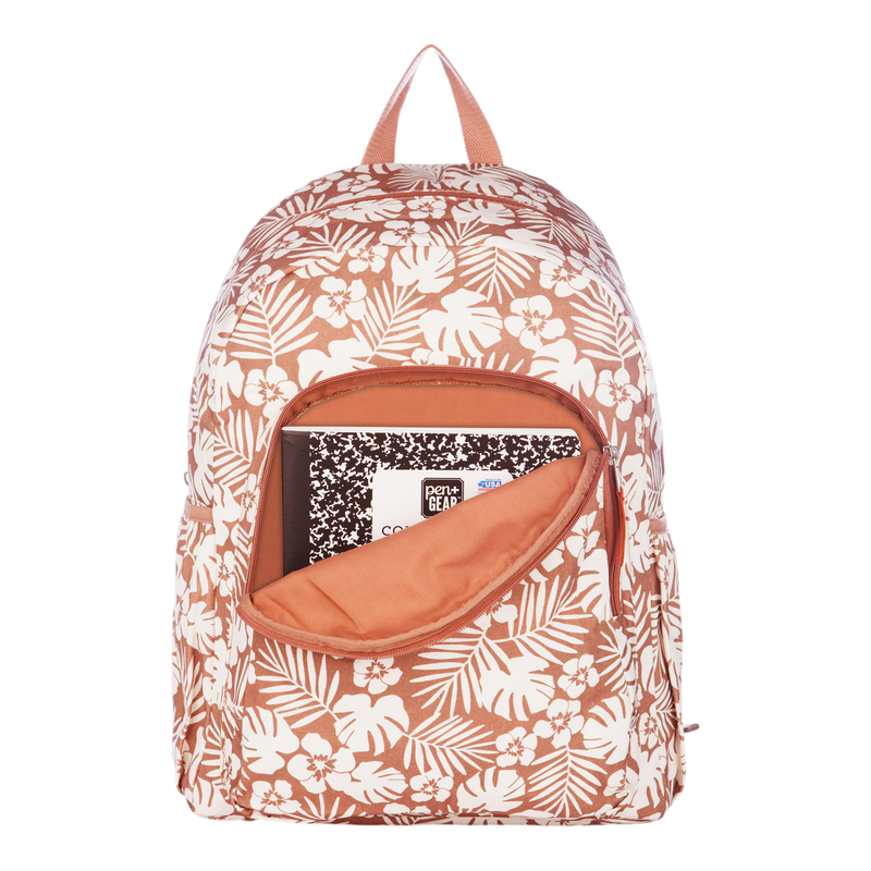 The Roxy Moon Magic Backpack in coral and white floral features a front pocket left unzipped, revealing a black-and-white composition notebook partially inside. The backpack also includes a top handle and convenient side pockets.