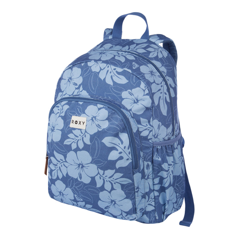 The Moon Magic Backpack by Roxy features a blue design with light blue floral patterns, a front zipper pocket, side pocket, top handle, and padded shoulder straps. The Roxy brand label is sewn onto the front pocket. The bag is displayed against a white background.