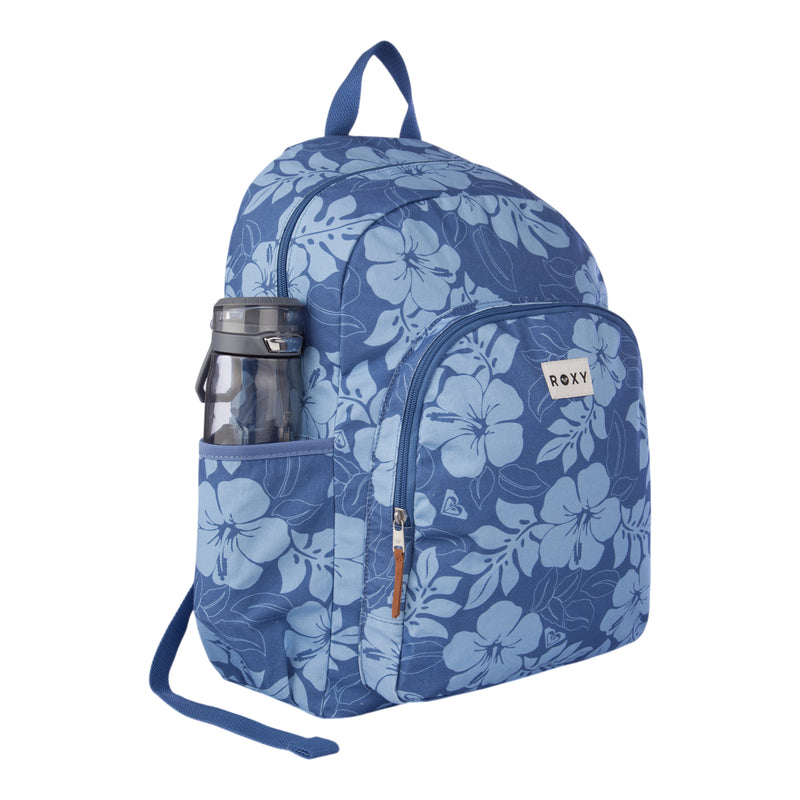 The Moon Magic Backpack by Roxy features a blue floral pattern, a front pocket with a white Roxy label, tan zipper pulls, and a water bottle in the side pocket. It comes with a top handle and adjustable shoulder straps for easy carrying.