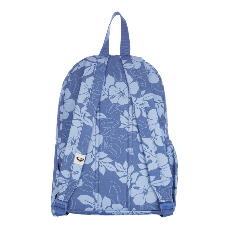 The Roxy Sugar Baby Canvas Backpack is shown from the back, featuring blue fabric with light blue floral patterns, adjustable shoulder straps, and a top handle.