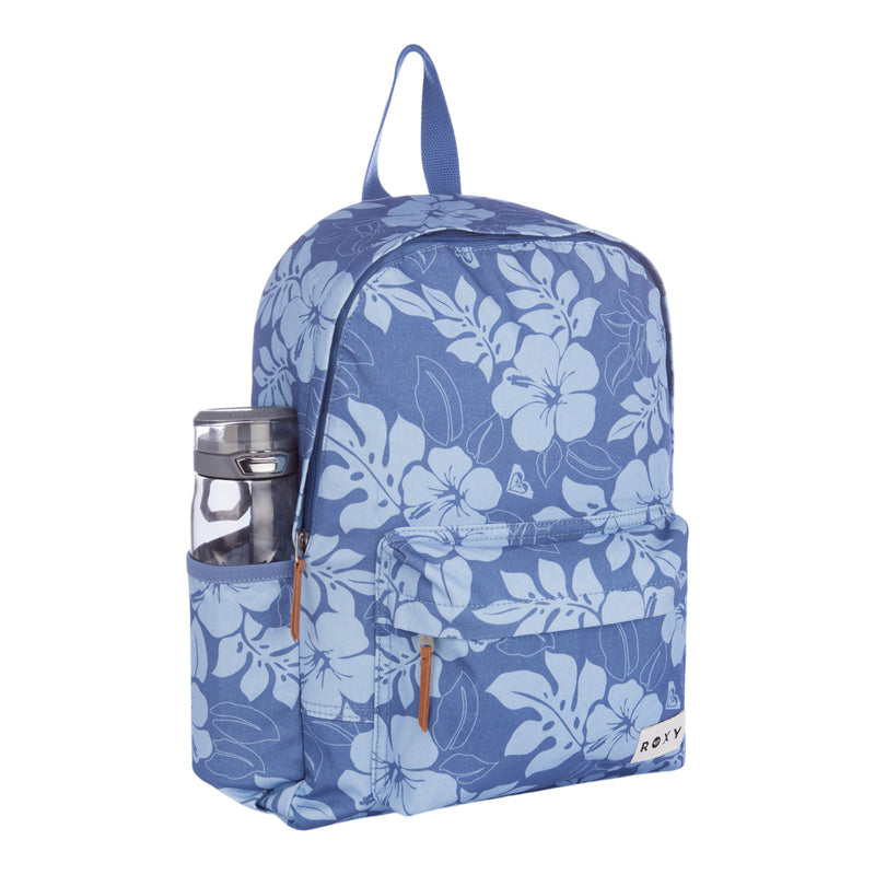 A blue floral-patterned Roxy Sugar Baby Canvas Backpack with tan zipper pulls, a front pocket featuring the ROXY label, and a clear water bottle tucked in its side pocket.