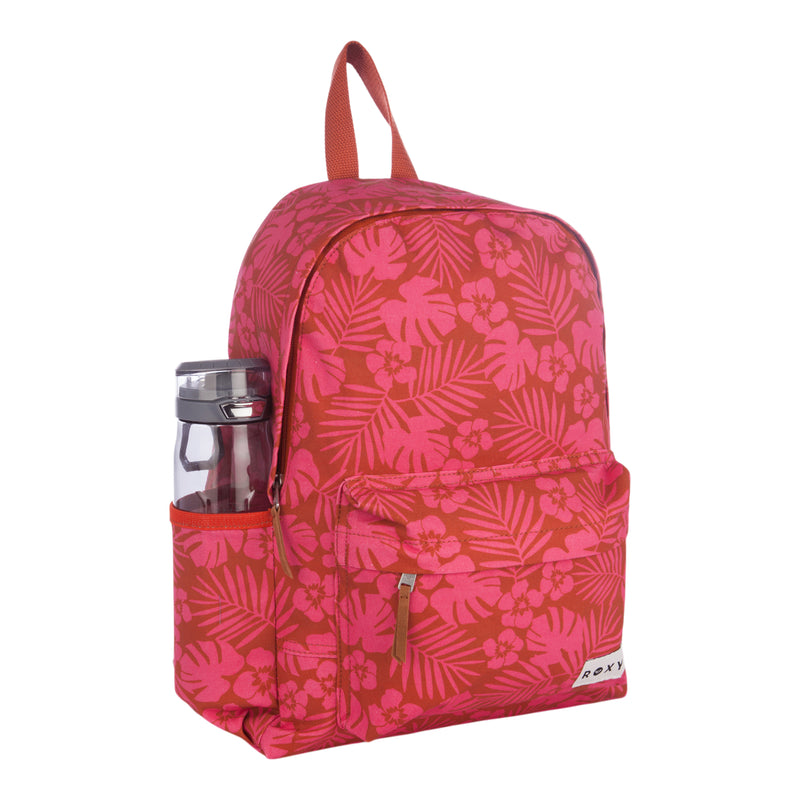 The Roxy Sugar Baby Canvas Backpack, featuring a red and pink floral pattern, is shown against a white background with a water bottle in the side pocket and a front zipper pocket.