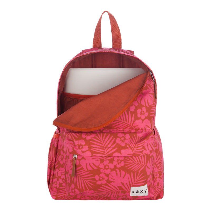 A pink and red floral-patterned Roxy Sugar Baby Canvas Backpack with an open zipper, revealing a laptop inside the main compartment. The backpack features a front pocket and a Roxy label at the bottom right.